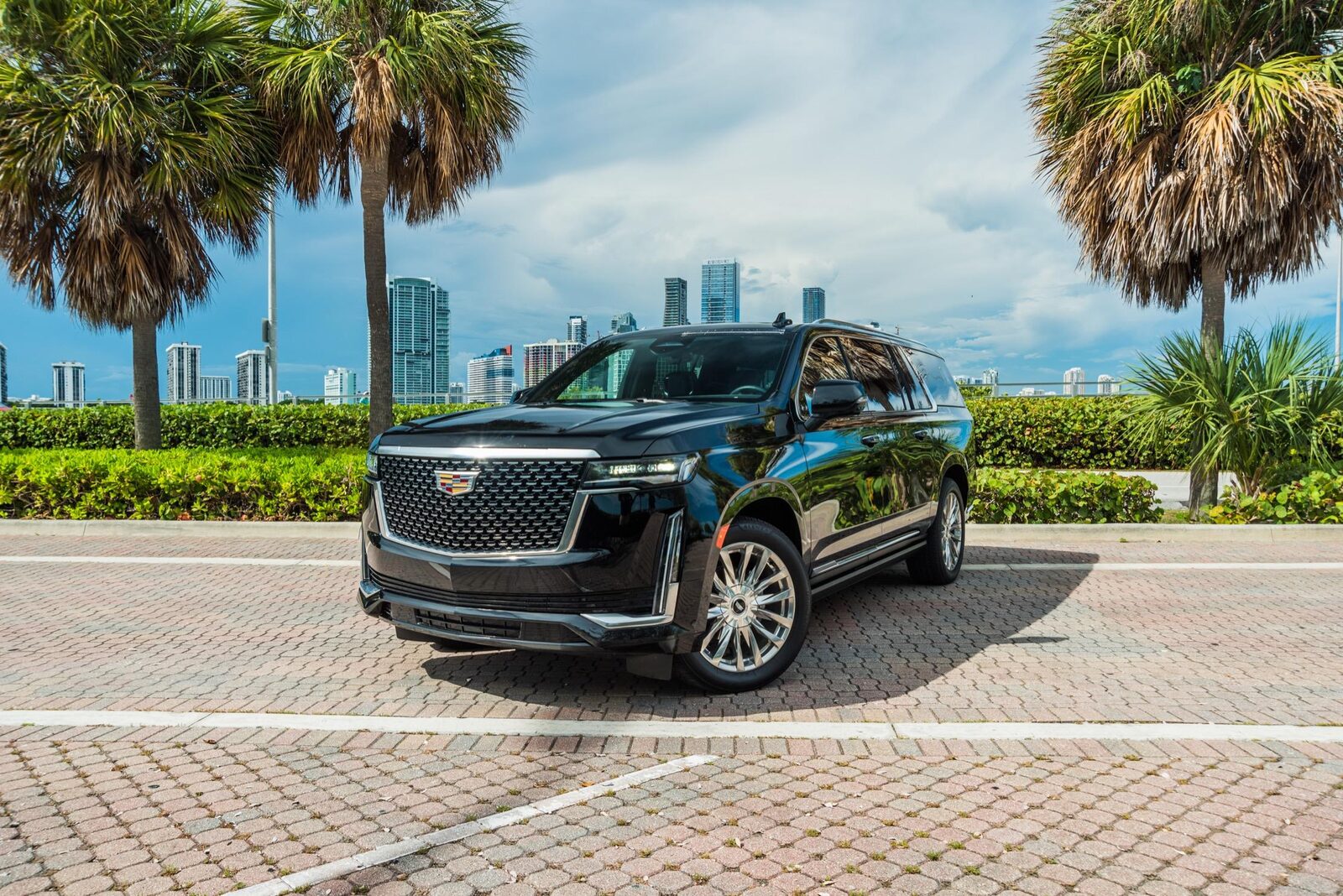 A black Cadillac Escalade parked on a Miami street